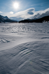 Wind sculpted snow fields., View towards Maloja from the lake shore of Lej da Segl with rare Snowdrift Formations. Abstract Formation, Engadin, Graubünden, Sils / Segl, Sils/Segl Baselgia, Snow, Switzerland, Waves of Ice, Winter