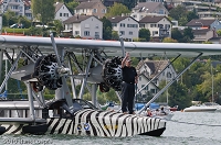 Sikorsky S-38 preparing for departure towards the wind. Tom Schrade, the pilot is standing on the bow of this masterpiece of aircraft.