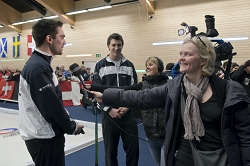 Joanna Kelly in charge of Media Relations for the World Curling Federation interviewing Peter de Cruz,  skip of the Swiss team winning Gold.