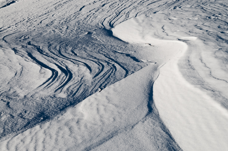 Snowdrift formations, Windblown snow drifts created icy waves. Abstract Formation, Engadin, Graubünden, Snow, Switzerland, Waves of Ice, Winter