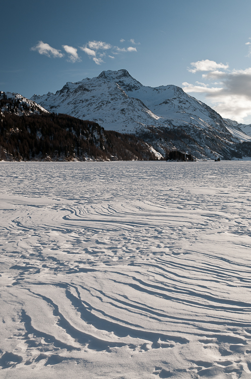 Snowdrift formations, Piz Margna and Wind sculpted snow fields on Lej da Segl. Abstract Formation, Engadin, Graubünden, Snow, Switzerland, Waves of Ice, Winter