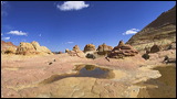 The Wave at Coyote Buttes, Paria Canyon and Vermilion Cliffs Wilderness area, The Coyote Buttes were formed mainly through the power of eroding winds. Wind brought in the layers of sand of various colors, later these layers petrified and now are eroded by wind again.<br>An amazingly special place worthwile visiting. Access is limited to 20 persons a day. A hiking permit is required. Inquire at the Ranger Station., 2006 / 04_23 The Wave, Page, United States of America, The Wave, Coyote Buttes South, Paria Canyon, Vermilion Cliffs, Wilderness Area, Page, Kanab, petrified Sand Dunes, Wind, Erosion