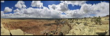 San Raffael Reef, Interstate 70 winds itself from Salina to Greenriver high up to the plateau of the San Raffael Swell offering phantastic sceneries. At Spotted Wolf (only a few Miles before getting into Green River) the road building engineers of I-70 had to overcome the San Rafael Reef., 2006 / 03_19 Reno-Vail, Greenriver, United States of America, Panorama, I-70, Clouds, Colorado Plateau, The Grand Staircase