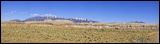 Cliffs along Notom-Bullfrog Road #1670, View from Notom-Bullfrog Road #1670 over Sandy Ranch. In the Background the Henry Mountains.<br>, 2006 / 04_16 Notom Road, Notom, United States of America, Panorama, Cliffs, Sandy Ranch, Ranch, Notom-Bullfrog Road #1670, Henry Mountains, Colorado Plateau, The Grand Staircase