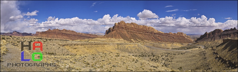 San Raffael Reef, Interstate 70 winds itself from Salina to Greenriver high up to the plateau of the San Raffael Swell offering phantastic sceneries. At Spotted Wolf (only a few Miles before getting into Green River) the road building engineers of I-70 had to overcome the San Rafael Reef., Greenriver, Utah, I-70, Clouds, Colorado Plateau, The Grand Staircase, Panorama, 20353-20357_flat.jpg